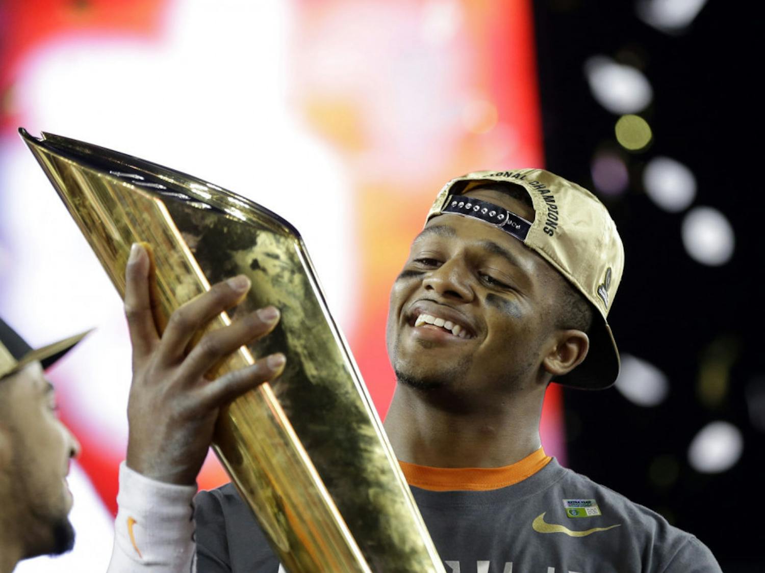 Clemson's Deshaun Watson holds up the championship trophy after the NCAA college football playoff championship game against Alabama Tuesday, Jan. 10, 2017, in Tampa, Fla. Clemson won 35-31. (AP Photo/David J. Phillip)