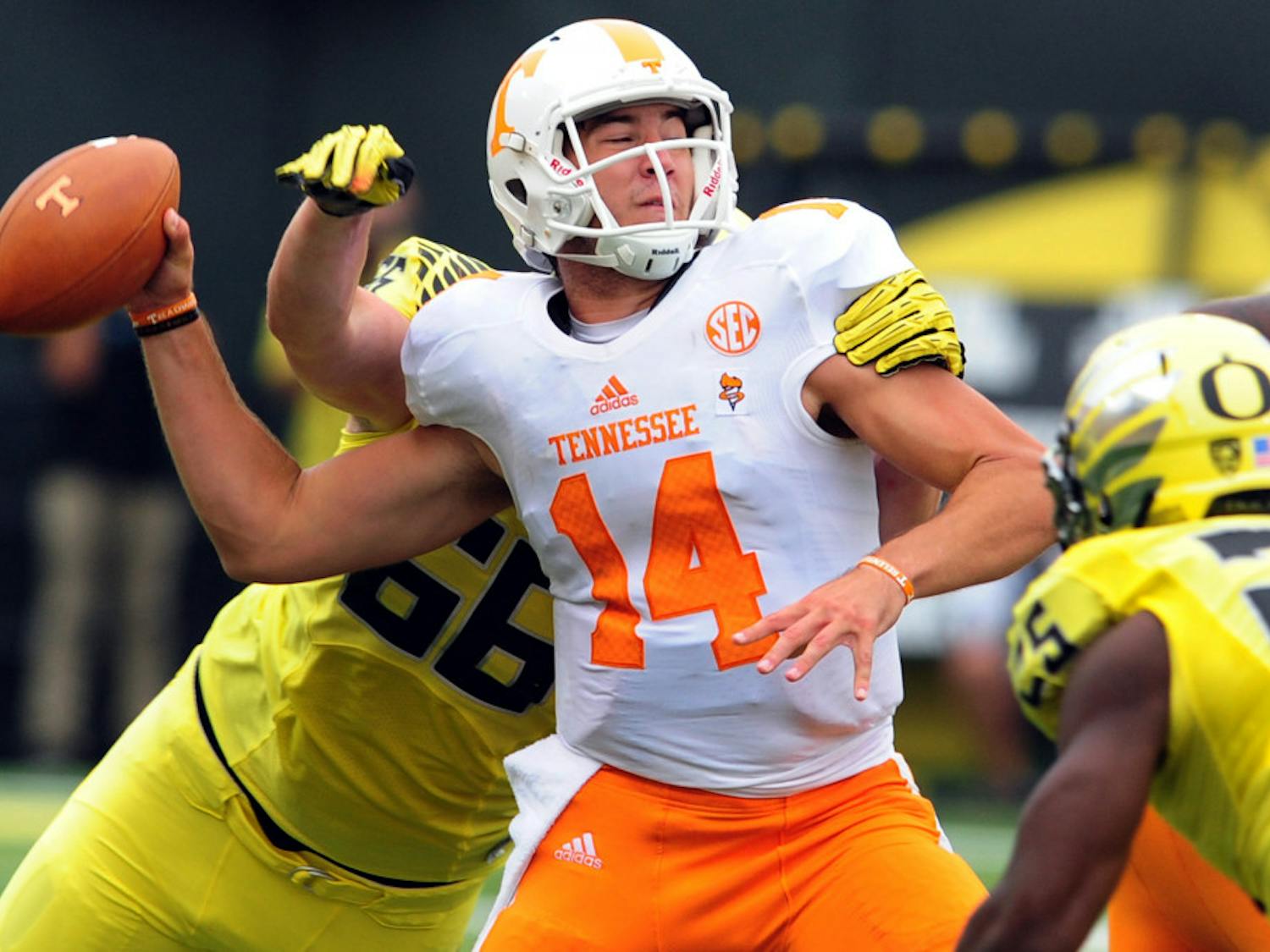 Tennessee quarterback Justin Worley (14) is sacked by Oregon defensive tackle Taylor Hart (66) during UT's 59-14 los in Eugene, Ore., Saturday, Sept. 14, 2013.