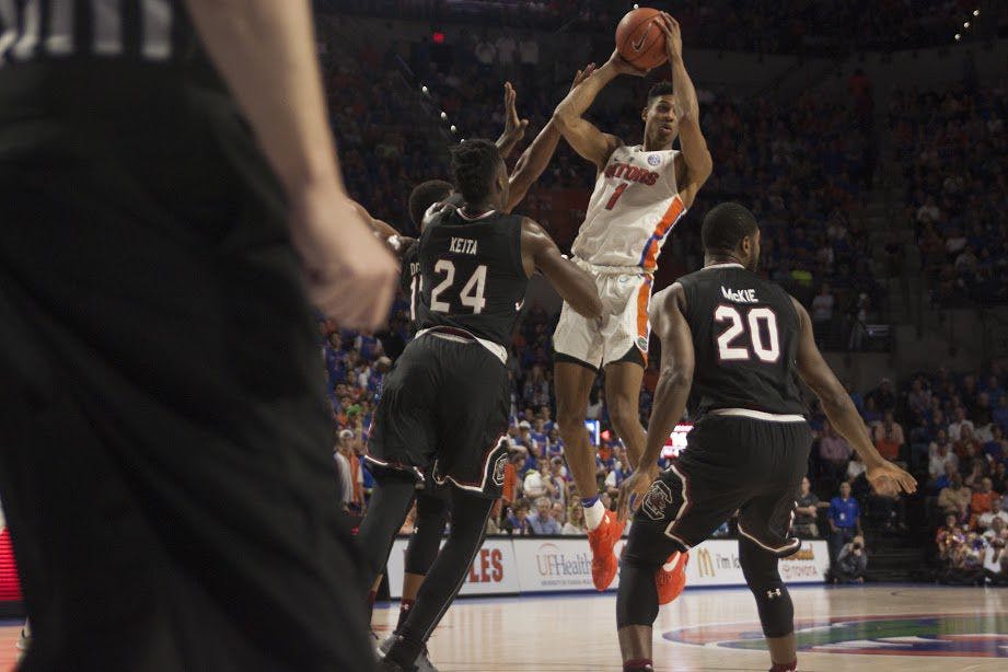 UF forward Devin Robinson looks to pass during Florida's 81-66 win against South Carolina on Feb. 21, 2017, in the O'Connell Center.&nbsp;