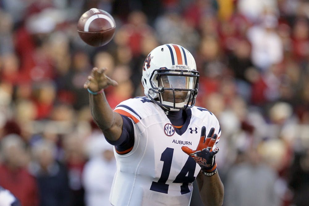 Auburn quarterback Nick Marshall passes in a 35-17 win against Arkansas in Fayetteville, Ark., on Nov. 2.