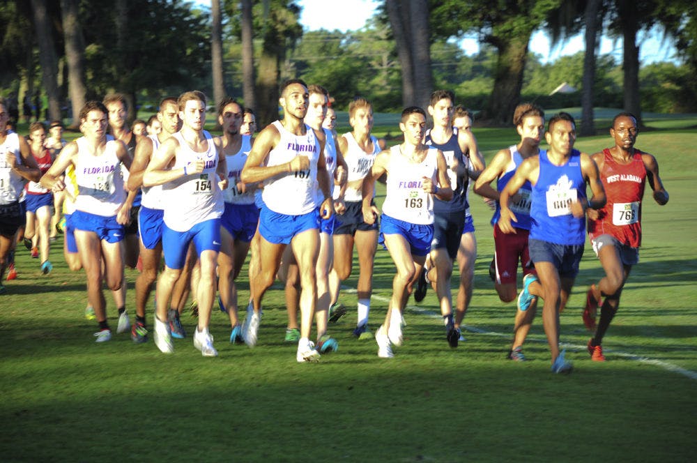 <p>UF's Eddie Garcia (middle) leads the pack during the 2015 Mountain Dew Invitational in Gainesville.</p>