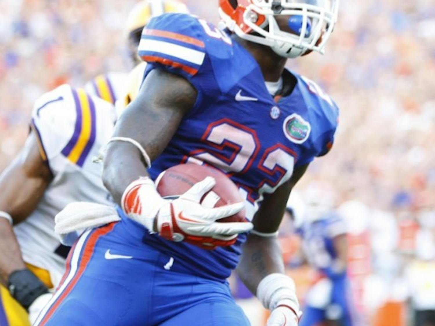 Senior running back Mike Gillislee sprints into the end zone untouched during UF’s 14-6 victory against LSU on Saturday at Ben Hill Griffin Stadium. Gillislee totaled 146 rushing yards and two touchdowns on 34 carries against the Tigers.