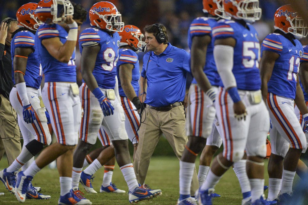 Coach Will Muschamp breaks from a huddle during Florida's 42-13 loss to Missouri on Oct. 18.