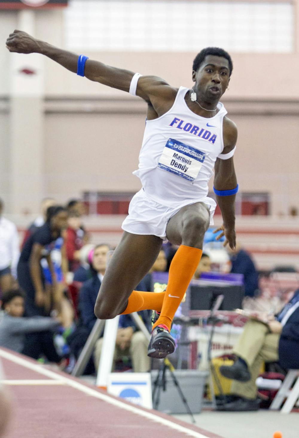 <p>Marquis Dendy competes in the triple jump during the 2015 NCAA Indoor Championships on March 14 in Fayetteville, Arkansas.</p>