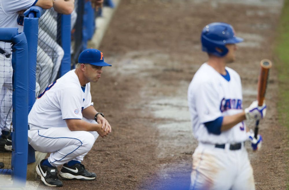 <p>UF coach Kevin O'Sullivan watches from outside the dugout during the Gators' 9-7 loss to Southern Miss. in game one of NCAA Super Regional play in McKethan stadium Saturday, June 6, 2009. O'Sullivan and the Gators were eliminated from the 2014 NCAA Tournament in the regional round on Saturday.</p>