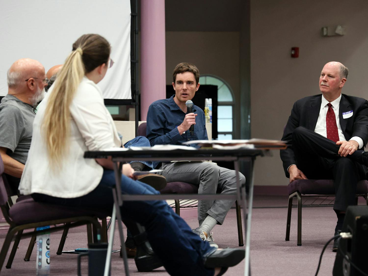 Dr. Robert Ainsworth, an assistant professor of economics at the University of Florida, answers a question about Trump’s budget bill at a “Just the Facts” town hall at Upper Room Ministries on Thursday, June 26, 2025.