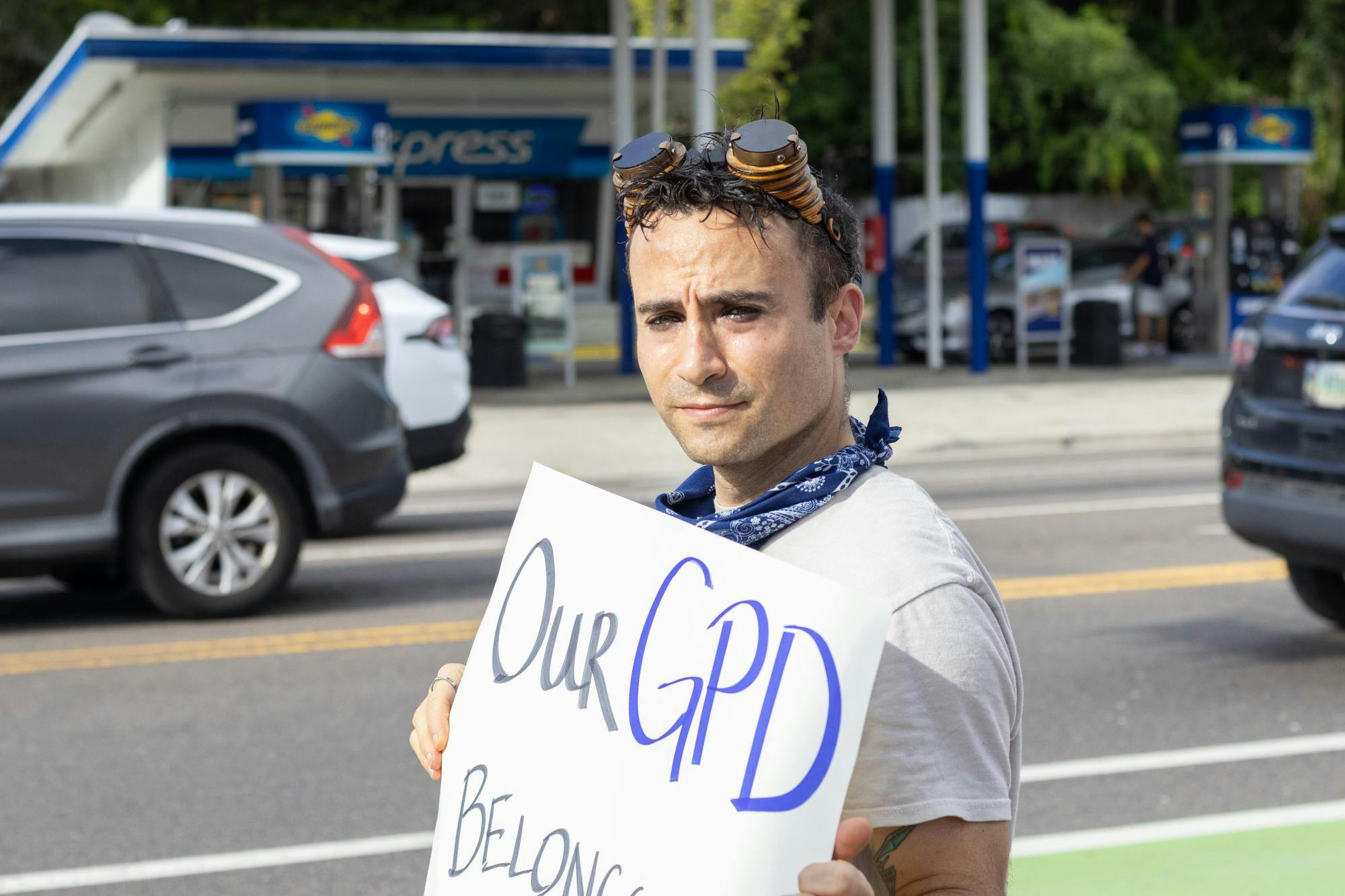 Former Gainesville mayoral candidate Evan Moon holds sign at anti-ICE protest in front of the GPD headquarters, Thursday, Sept. 3, 2026, in Gainesville, Fla.