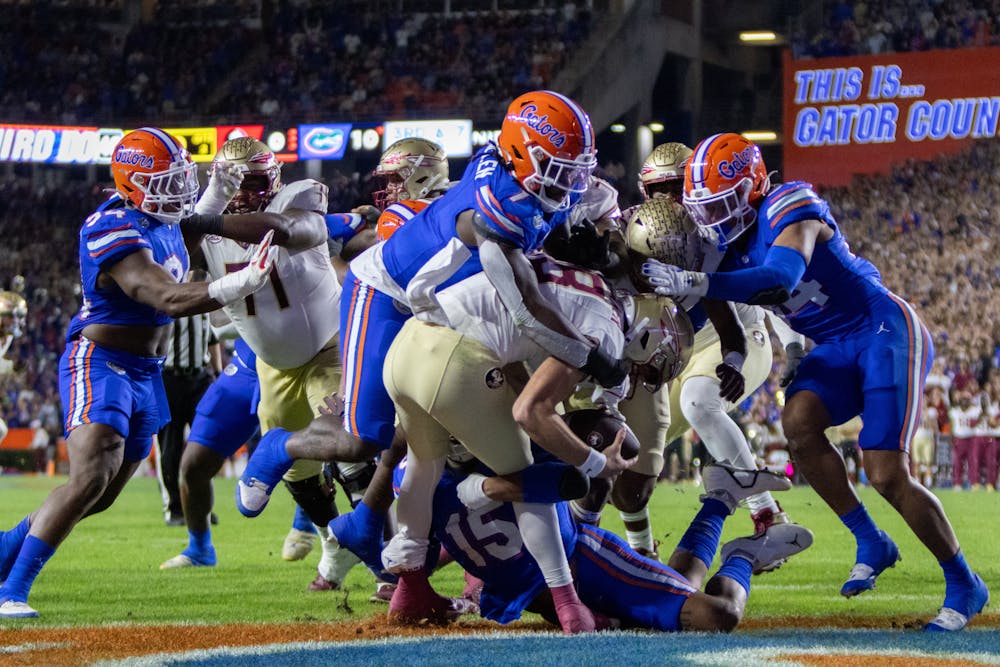 The Gators' defense sacks FSU quarterback Tate Rodemaker in the endzone for a safety in Florida's 24-15 loss to the Florida State Seminoles on Saturday, Nov. 25, 2023.