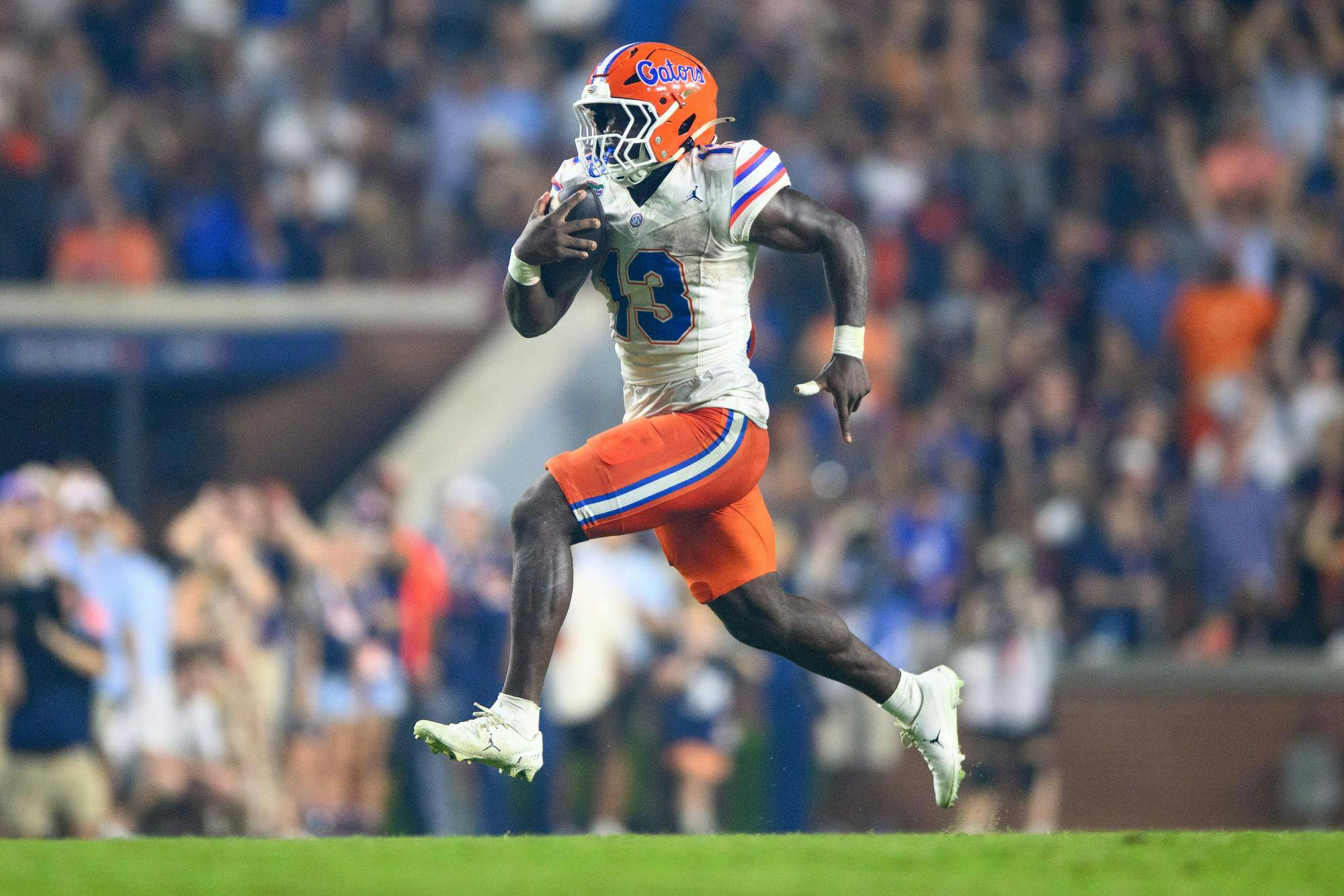 Florida running back Jadan Baugh (13) rushes for a touchdown during the second half of an NCAA college football game against Auburn, Saturday, Sept. 19, 2026, in Auburn, Ala.