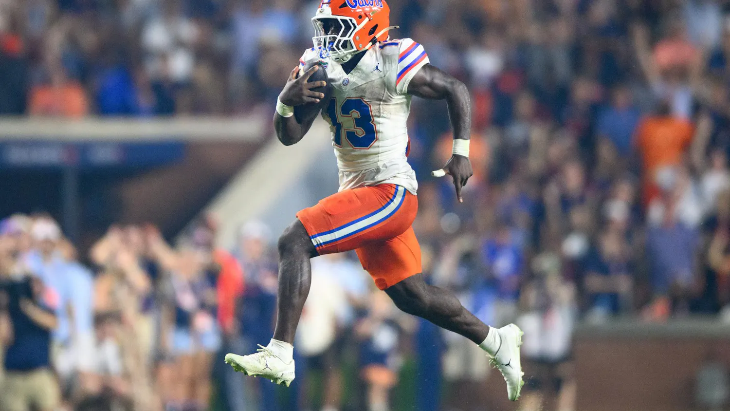 Florida running back Jadan Baugh (13) rushes for a touchdown during the second half of an NCAA college football game against Auburn, Saturday, Sept. 19, 2026, in Auburn, Ala.