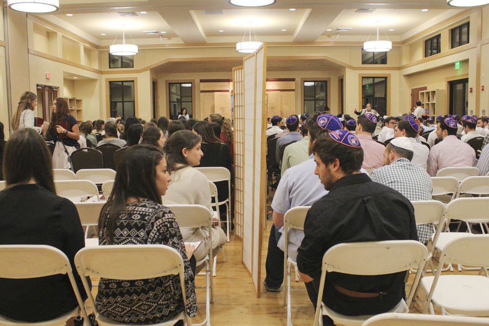 The Lubavitch-Chabad Jewish Student and Community Center hosted full Yom Kippur services Sept. 22, 2015, for students and the local community. As the services proceeded, a steady stream of people continued to file into the center for services and prayer for Judaism’s holiest day of the year.