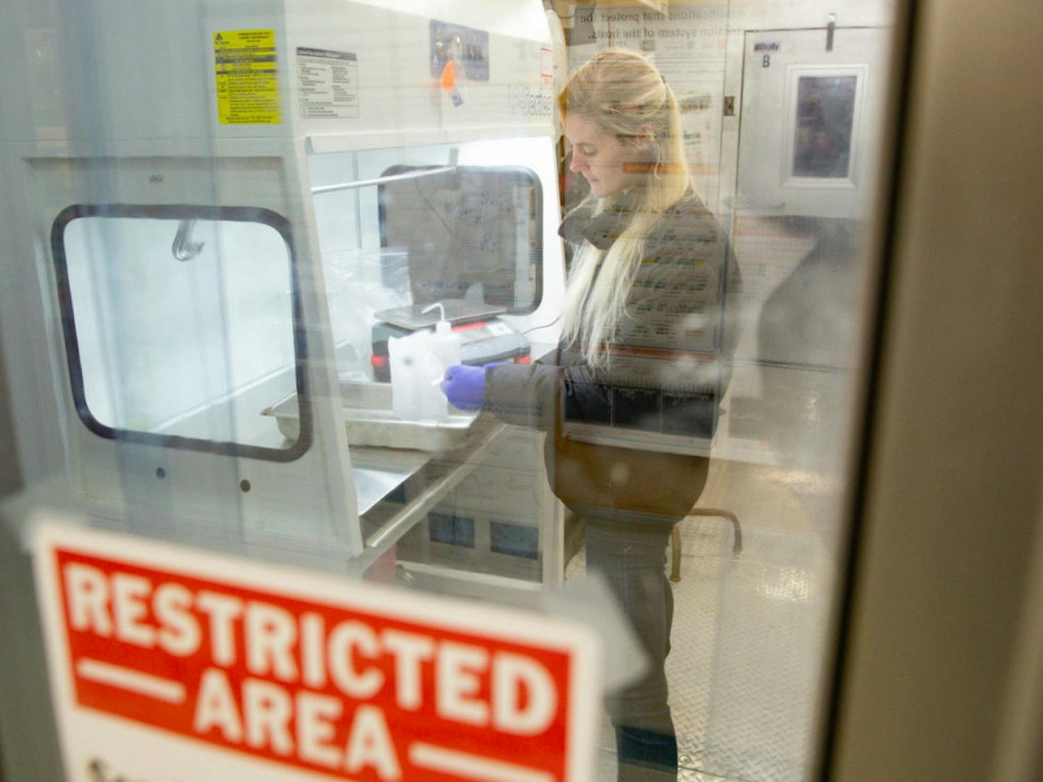 Christina Davis working in a microbiology and cell science lab in preparation for field work in Antarctica on Tuesday, November 20th, 2018.
