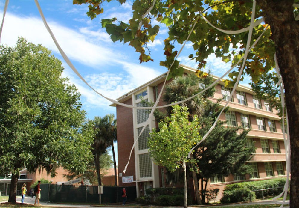 <p>Toilet paper hangs from trees in front of Broward Hall on Wednesday. The incident followed pranks pulled in the residence hall earlier this semester that led to security cameras being installed.</p>