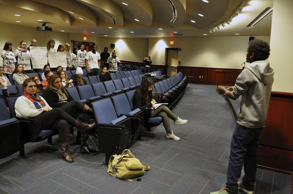 Yehuda M., a 27-year-old Ethiopian-born IDF soldier, speaks to a crowd about his experience serving for Israel as a part of the pro-Israel StandWithUs speaking series at the Reitz Welcoming Center on Thursday. Students for Justice in Palestine organized a walk-out later in the speech.