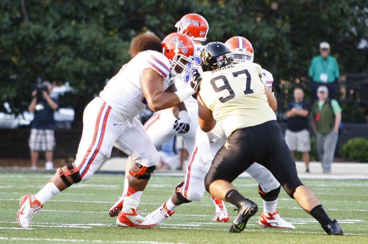Redshirt senior guard Jon Halapio (left) blocks Vanderbilt defensive tackle Jared Morse (97) during the Gators’ 31-17 win against the Commodores on Oct. 13 in Nashville, Tenn. Halapio is listed as a starter on Florida's most recent depth chart.