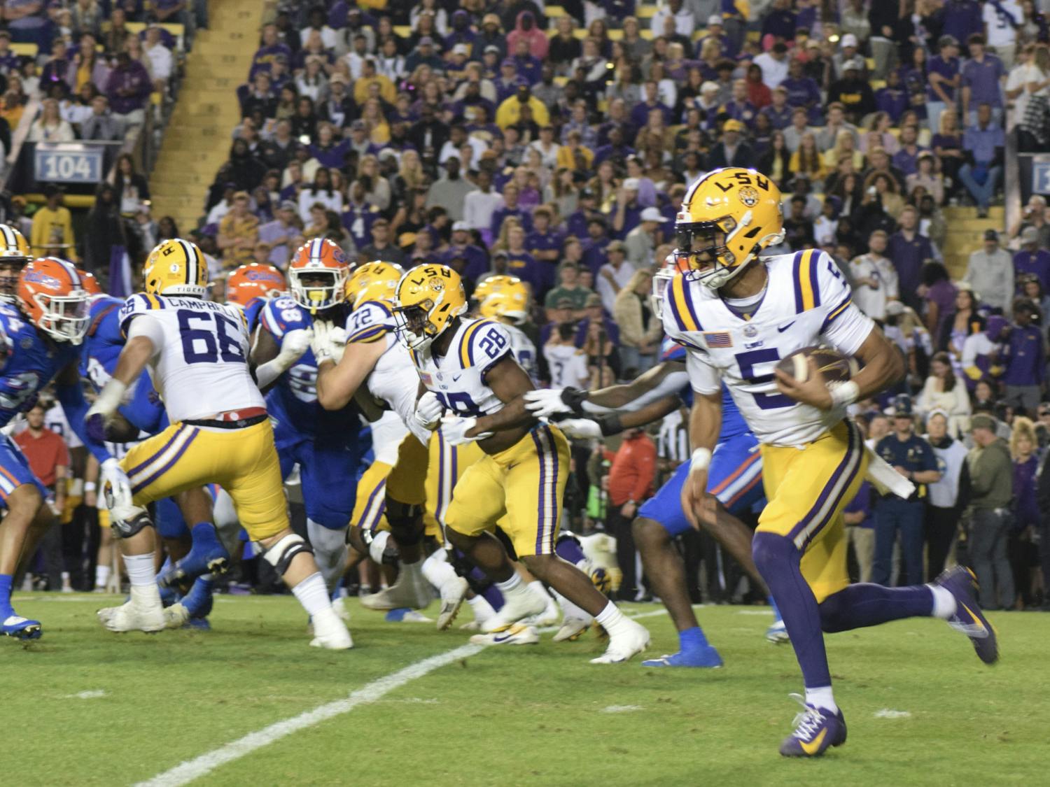 LSU quarterback Jayden Daniels runs the ball in the Gators' 52-35 loss to the LSU Tigers on Saturday, Nov. 11, 2023.