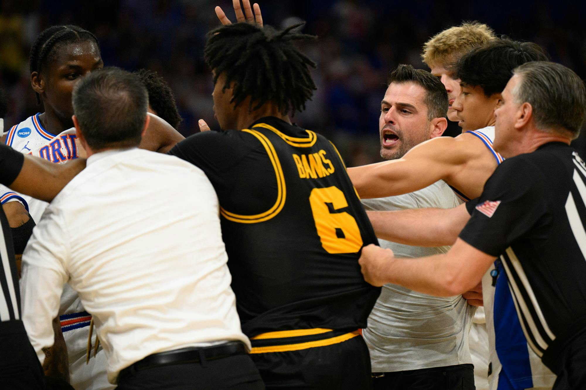 Florida head coach Todd Golden rushes a huddle during the first half of an NCAA Tournament second round game against Iowa, Sunday, March 22, 2026, in Tampa, Fla.