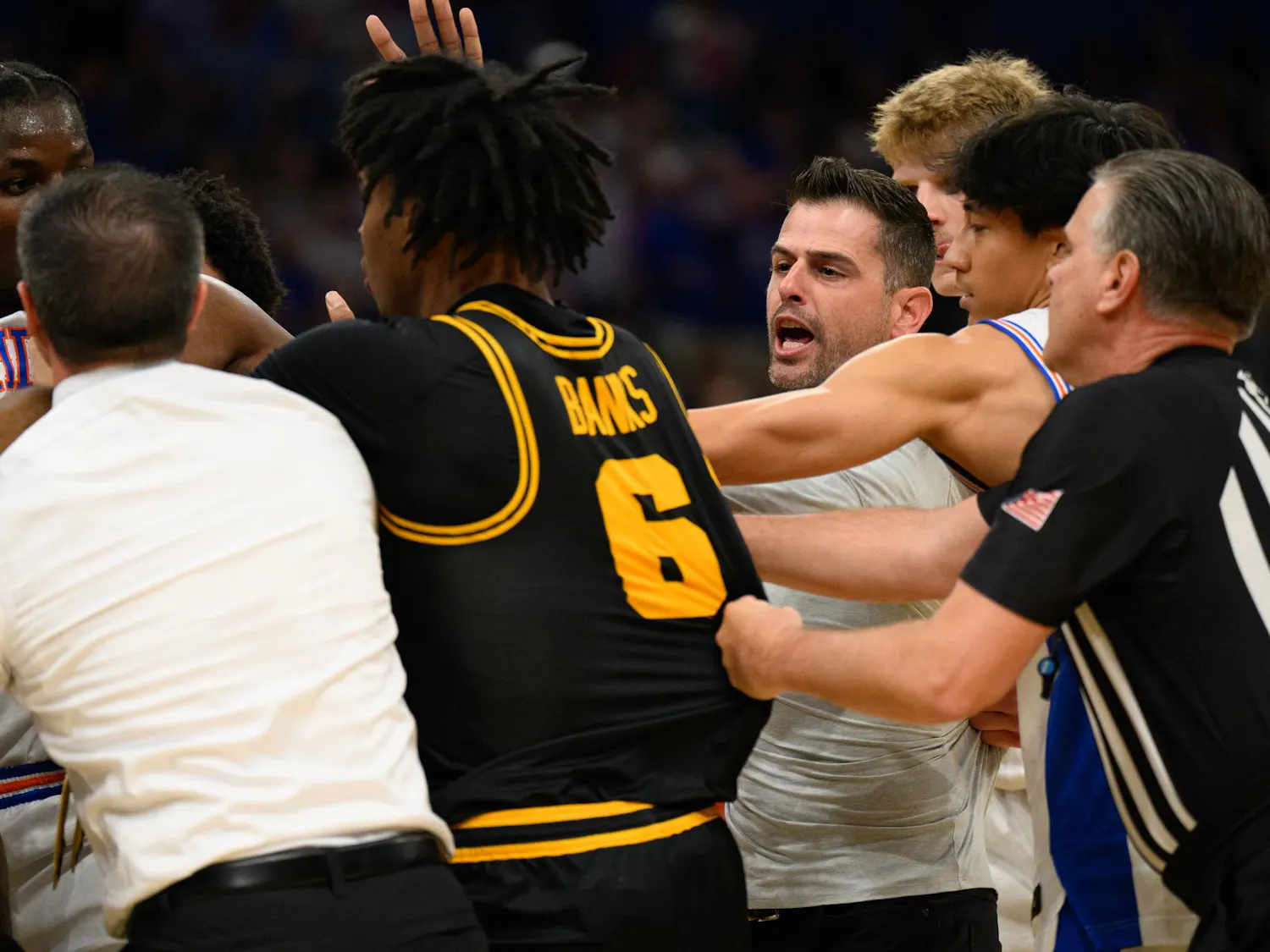 Florida head coach Todd Golden rushes a huddle during the first half of an NCAA Tournament second round game against Iowa, Sunday, March 22, 2026, in Tampa, Fla.