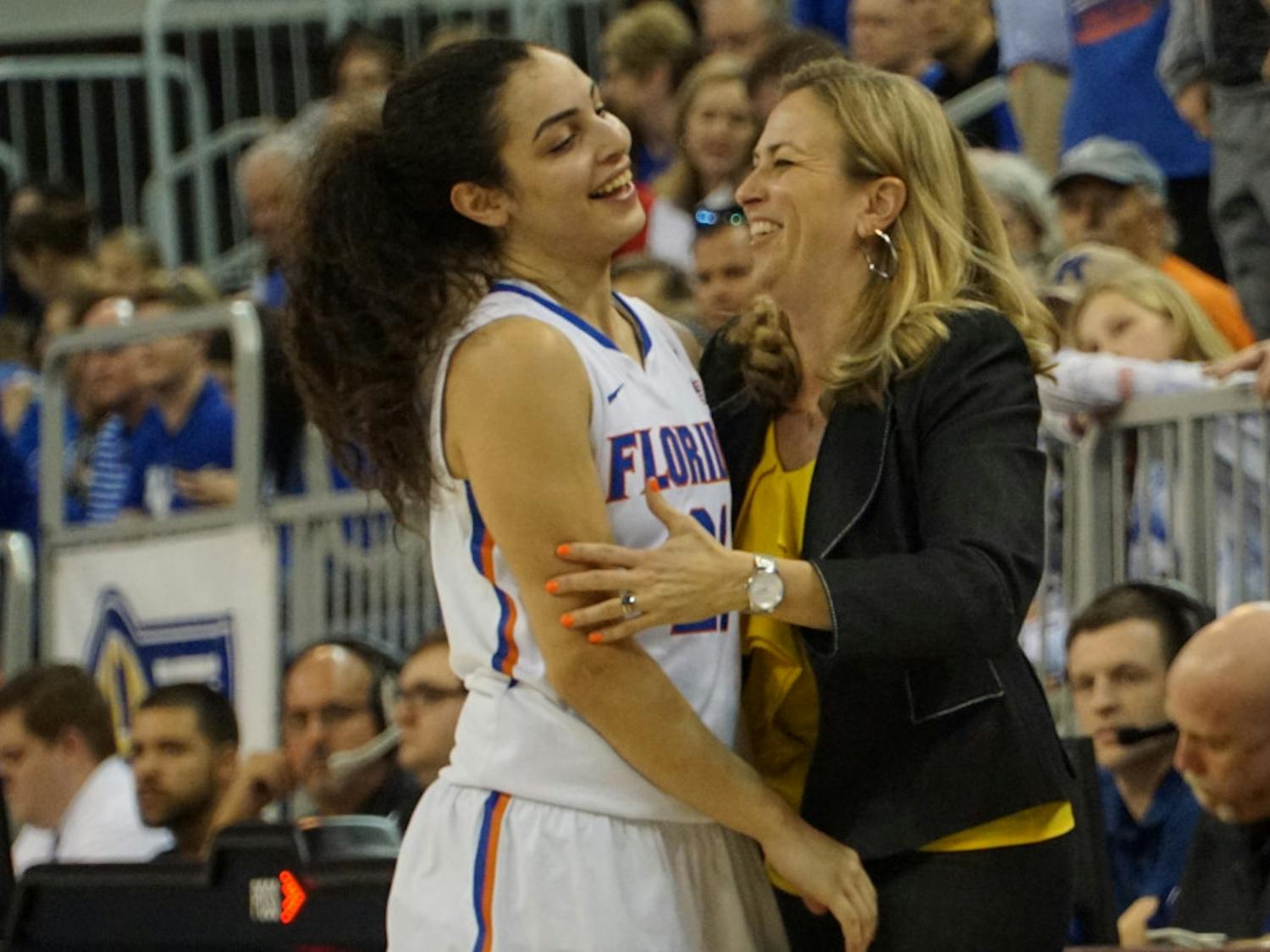 Coach Amanda Butler (right) celebrates with Eleanna Christinaki during Florida's win over Kentucky on Jan. 31, 2016, in the O'Connell Center.