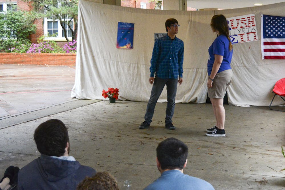 <p>Lucas Sanders, a 19-year-old UF computer engineering freshman, performs a selected scene from Shakespeare’s “Much Ado About Nothing,” as Benedick alongside Sarah Emily Hall, a 20-year-old UF psychology sophomore, as Beatrice on the Library West Breezeway on Thursday evening.</p>