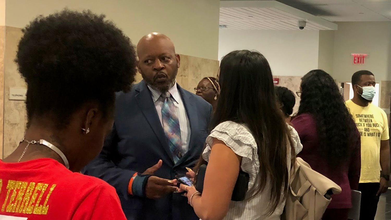 Terrell Bradley’s father Victor Bradley speaks with local activist Danielle Chanzes as they both await Judge Walter Green’s decision outside of the Alachua County Stephen P. Mickle Criminal courtroom Tuesday, July 19, 2022.