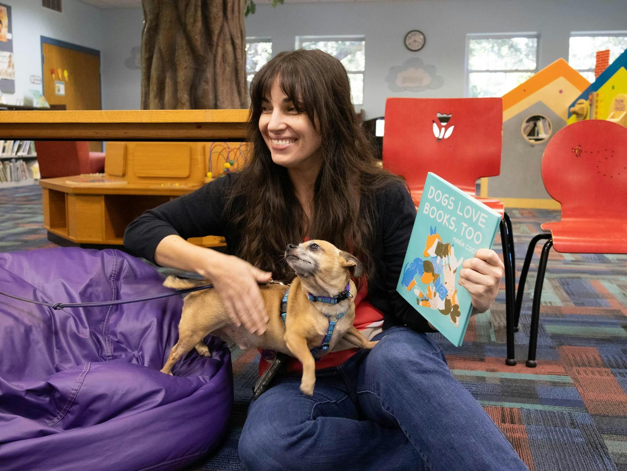 Colleen Tobin and Eddie at the Read with a Dog program at Alachua County Millhopper Branch Library on Thursday, Oct. 17, 2025.