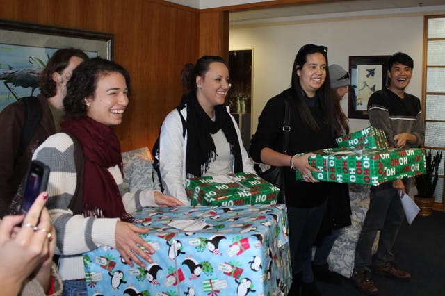 Gator Students Against Sweatshops delivered empty Christmas presents to President Bernie Machen's office Wednesday to protest UF's affiliation with Adidas.