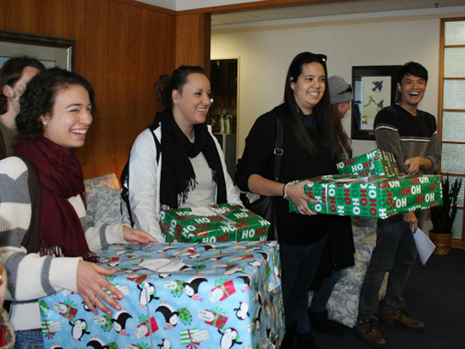 Gator Students Against Sweatshops delivered empty Christmas presents to President Bernie Machen's office Wednesday to protest UF's affiliation with Adidas.