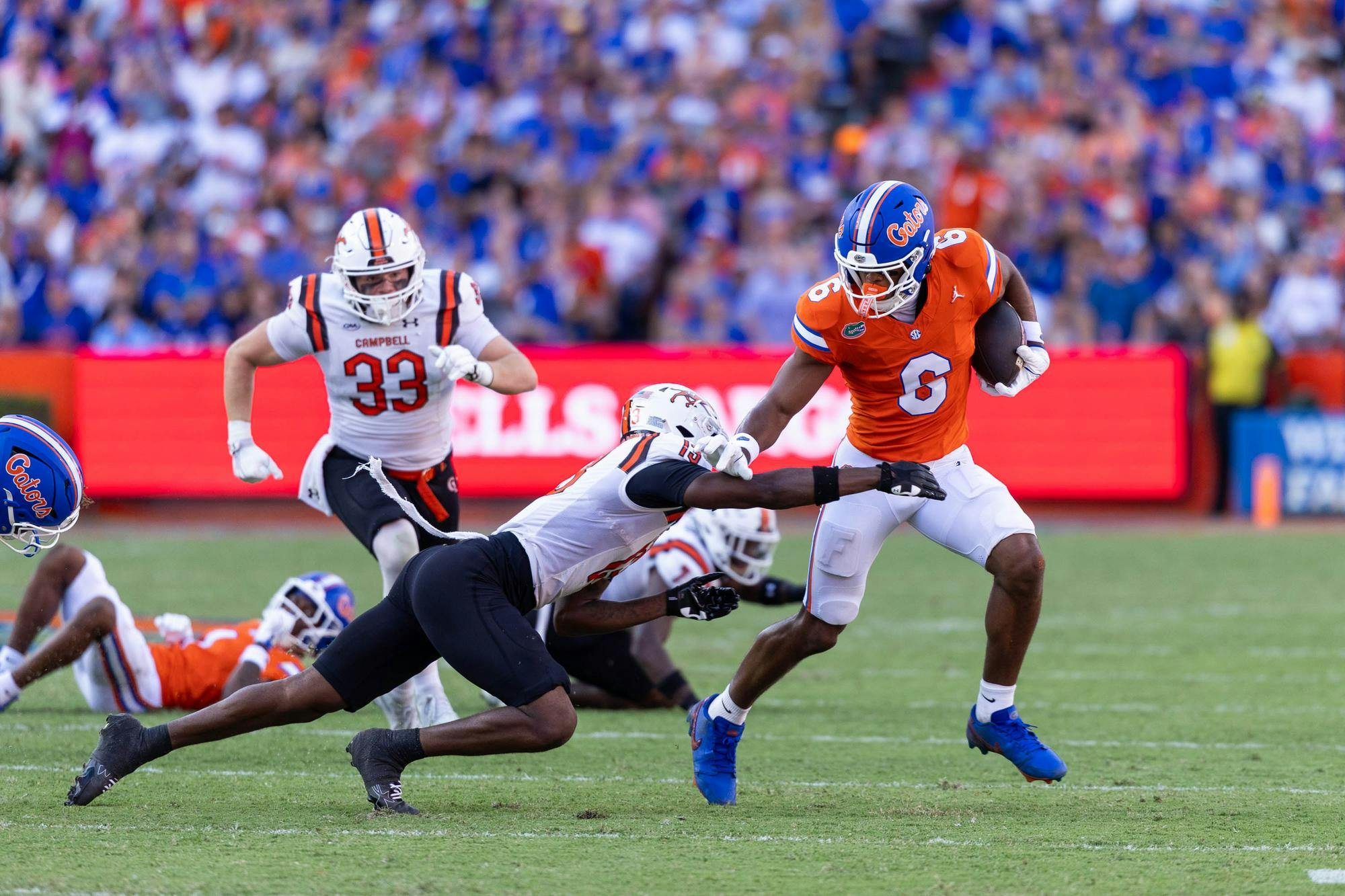 Florida wide receiver Dallas Wilson (6) runs with the ball in the first half of an NCAA college football game against Campbell, Saturday, Sept. 12, 2026, in Gainesville, Fla.