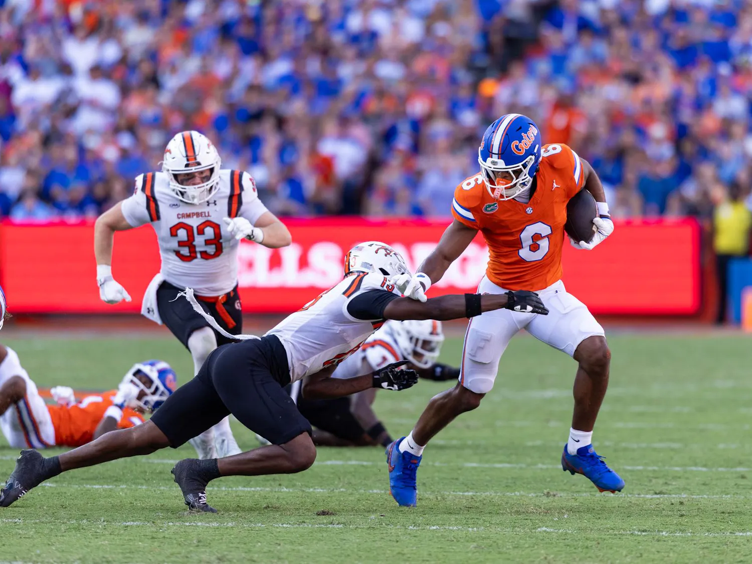 Florida wide receiver Dallas Wilson (6) runs with the ball in the first half of an NCAA college football game against Campbell, Saturday, Sept. 12, 2026, in Gainesville, Fla.
