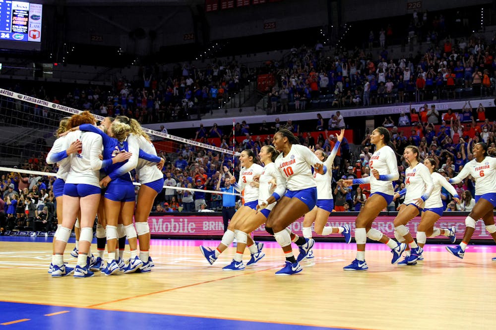 The Florida Gators volleyball team celebrates after they defeated the Minnesota Golden Gophers 3-0 Sunday, Sept. 3, 2023. 