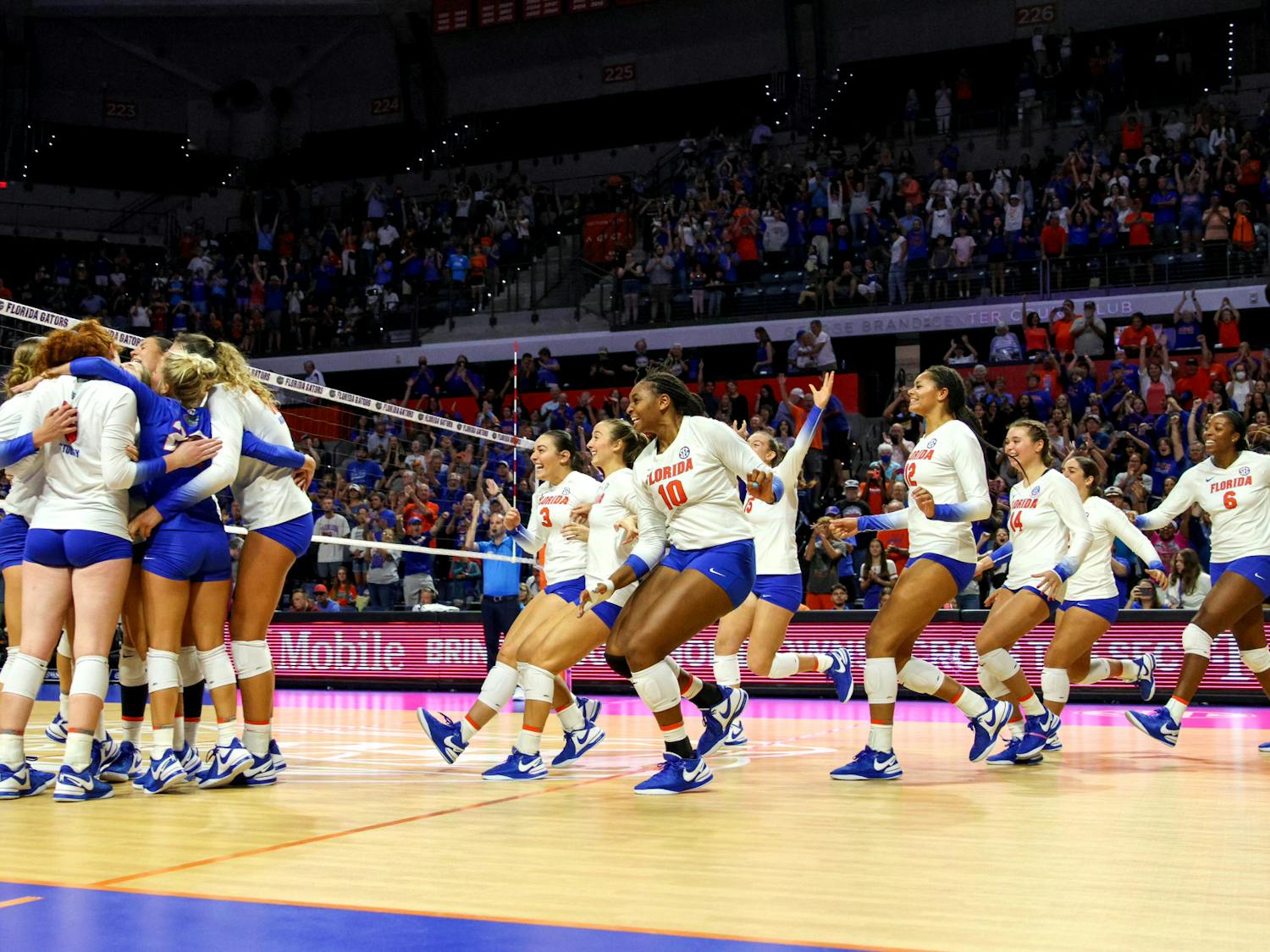 The Florida Gators volleyball team celebrates after they defeated the Minnesota Golden Gophers 3-0 Sunday, Sept. 3, 2023. 