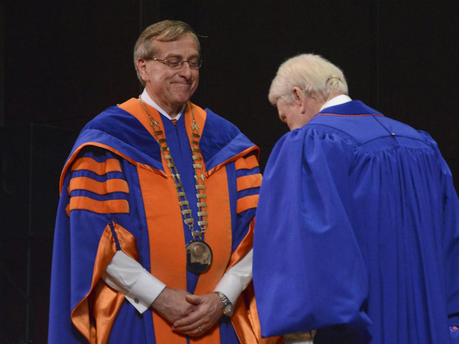UF President Kent Fuchs receives the presidential chain of office on Dec 4, 2015. The inauguration ceremony officially welcomed him as UF’s 12th president.