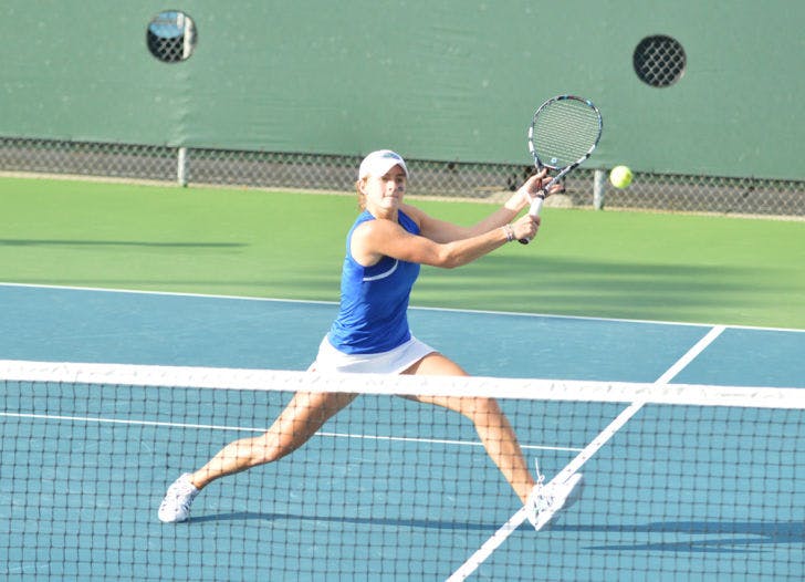Kourtney Keegan swings at the ball during Florida’s 7-0 win against Florida State on Feb. 18 at the Ring Tennis Complex.