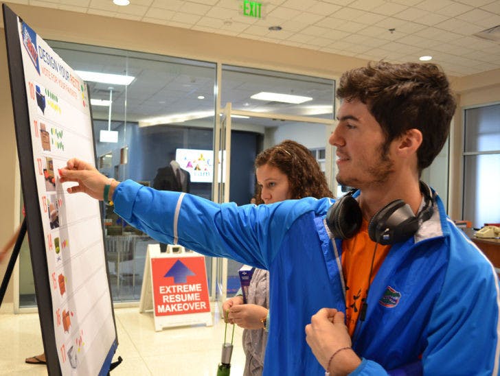 Graphic design freshman Matthew Flannigan, 19, casts his vote for chairs to go in the renovated Reitz Union. His favorite is No. 11 because it’s “comfortable and convenient” with built-in desk and outlets.