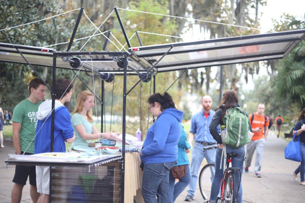 <p>Sustainable UF has a new solar-powered hut, used to play games with students and educate them about environmental sustainability. The hut is made of reclaimed wood and locally sourced steel and pulled by a bike.</p>