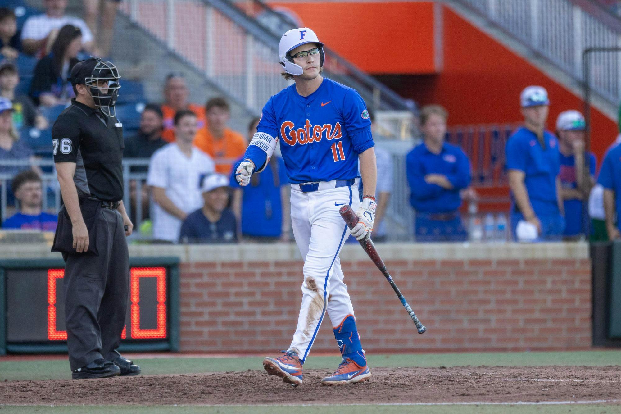 Florida infielder Brendan Lawson (11) walks back to the dugout after striking out during an NCAA college baseball game against Auburn at Condron Family Ballpark in Gainesville, Fla., Friday, April 17, 2026.