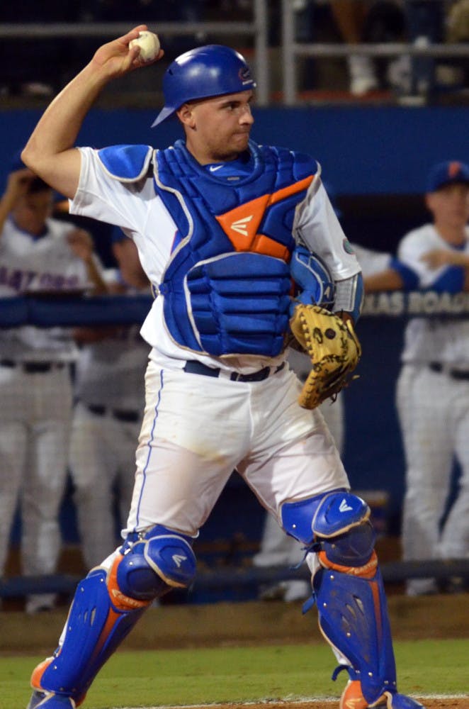 UF's Mike Rivera throws a ball back to pitcher Bobby Poyner (not pictured) during Florida's 14-3 win against the South Carolina Gamecocks on April 11, 2015 at McKethan Stadium.