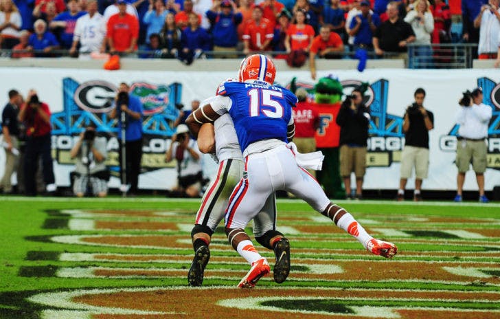 Loucheiz Purifoy sacks Georgia’s Aaron Murray (11) for a safety at EverBank Field on Nov. 2, 2013, in Jacksonville. Florida is looking for one of its recruits to replace Purifoy’s production after he left for the NFL Draft.