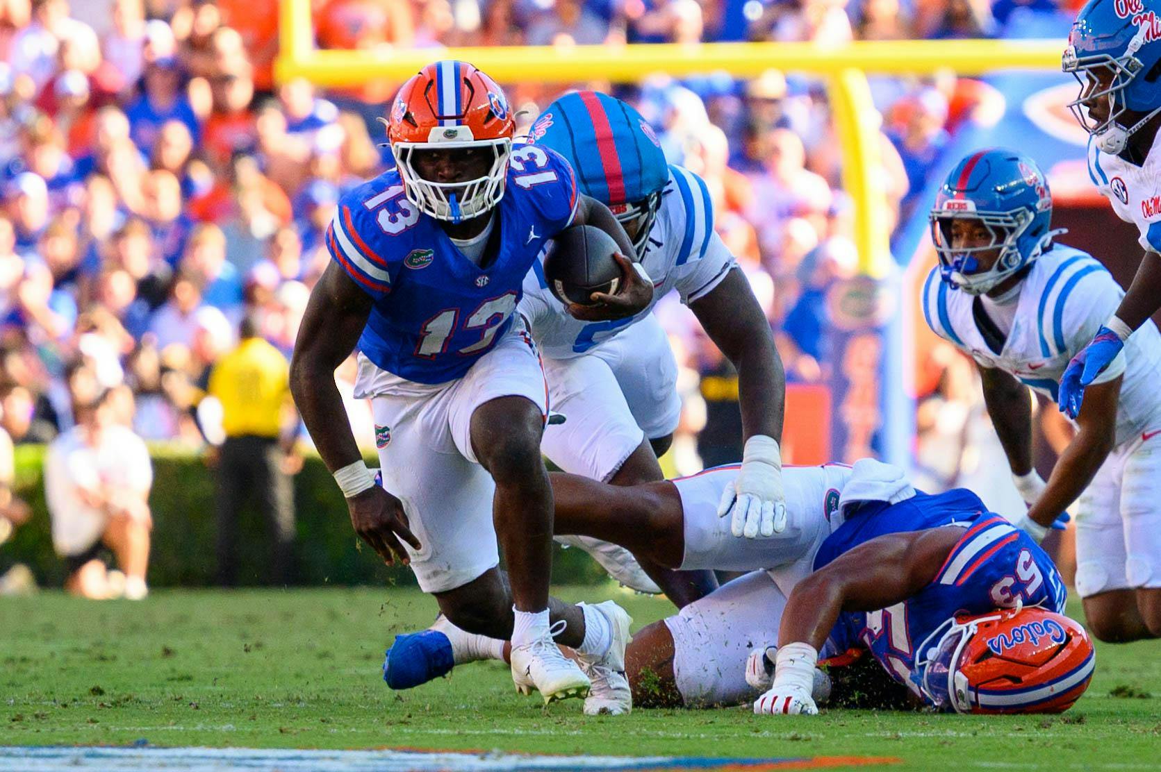 Florida running back Jadan Baugh (13) runs to the end zone during the first half of an NCAA college football game against Ole Miss, Saturday, Sept. 26, 2026, in Gainesville, Fla.