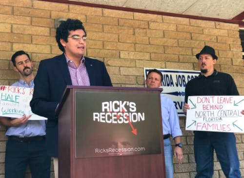 City Commissioner David Arreola speaks&nbsp;outside of the closed Gainesville Job Corps Office on Wednesday for the Gainesville stop in the Rick’s Recession tour.