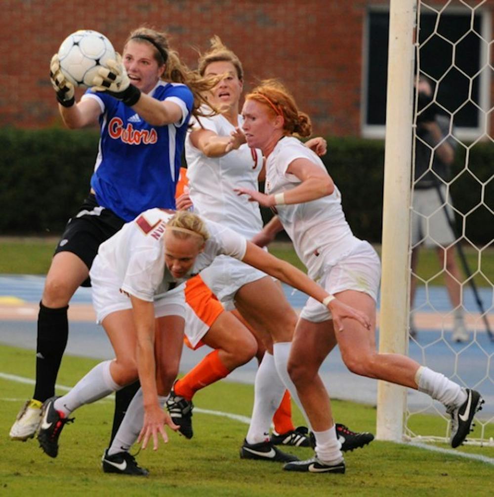<p>Gators sophomore goalkeeper Taylor Burke makes a save against the Tennessee Volunteers during a game in 2011. Burke played the second half in Florida's 3-0 home loss on FSU on Friday night.</p>