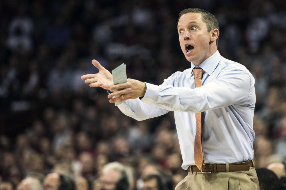 Florida head coach Mike White communicates with players during the first half of an NCAA college basketball game against South Carolina Wednesday, Jan. 18, 2017, in Columbia, S.C. (AP Photo/Sean Rayford)