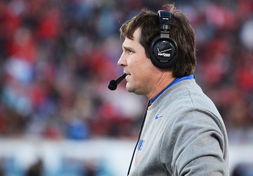 <p>Florida coach Will Muschamp looks down the field during Florida's 38-20 win against Georgia on Saturday at EverBank Field in Jacksonville.</p>