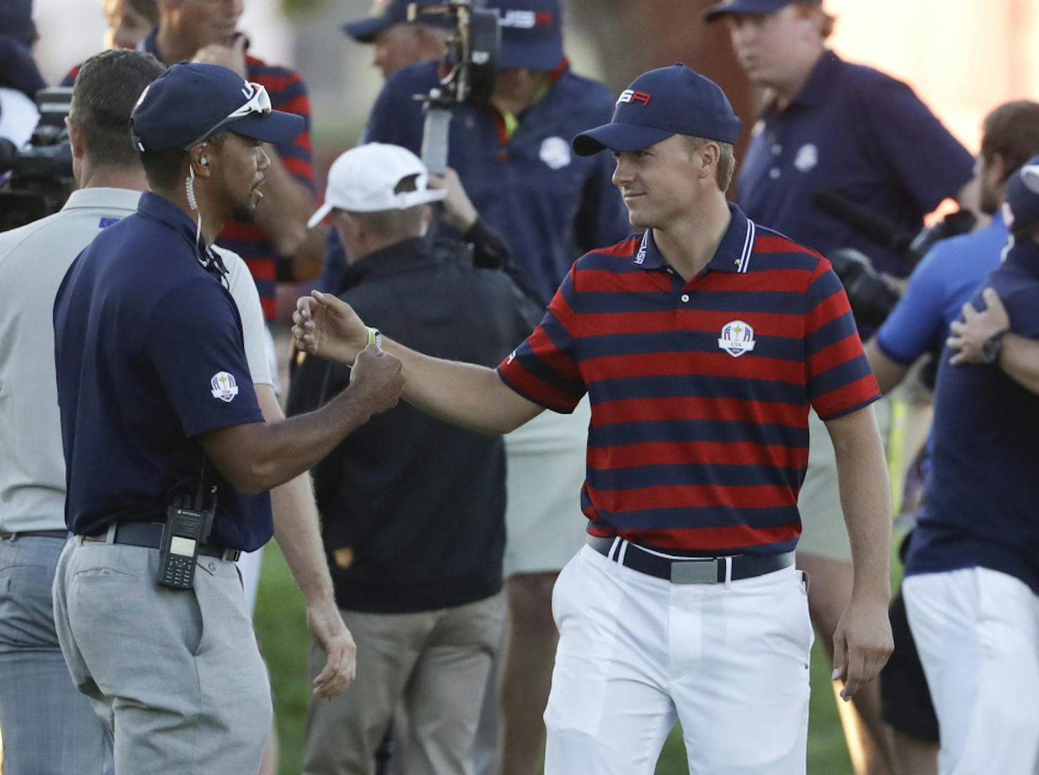 United States vice-captain Tiger Woods congratulates United States’ Jordan Spieth after a four-ball match at the Ryder Cup golf tournament Saturday, Oct. 1, 2016, at Hazeltine National Golf Club in Chaska, Minn. (AP Photo/Chris Carlson)