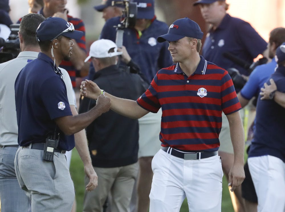 <p>United States vice-captain Tiger Woods congratulates United States’ Jordan Spieth after a four-ball match at the Ryder Cup golf tournament Saturday, Oct. 1, 2016, at Hazeltine National Golf Club in Chaska, Minn. (AP Photo/Chris Carlson)</p>