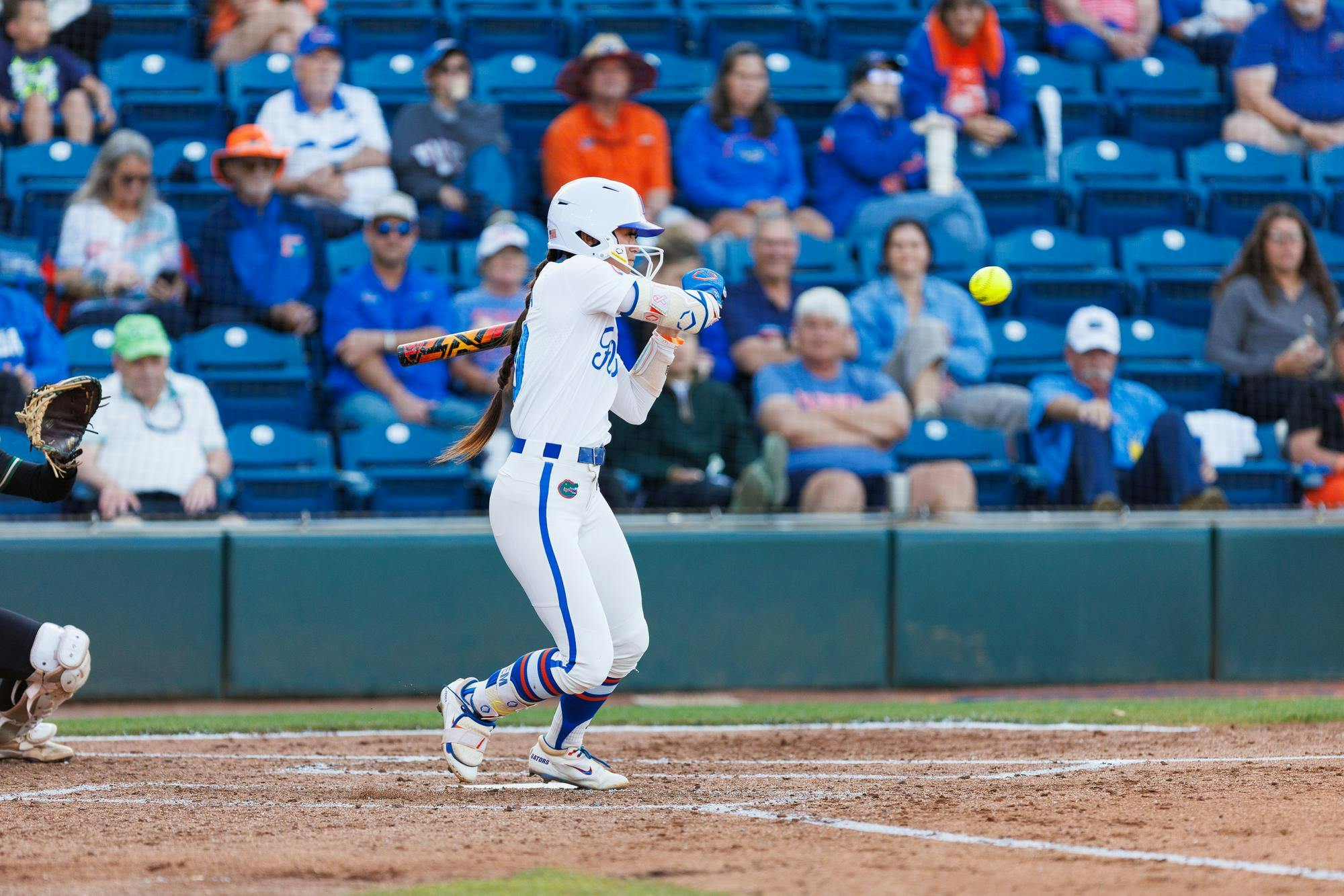 Florida Gators infielder Gabi Comia swings during an NCAA softball game against Stetson, Wednesday, March 25, 2026, in Gainesville, Fla.