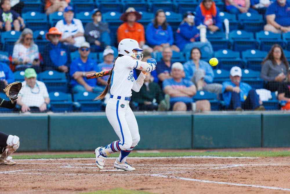 Florida Gators infielder Gabi Comia swings during an NCAA softball game against Stetson, Wednesday, March 25, 2026, in Gainesville, Fla.