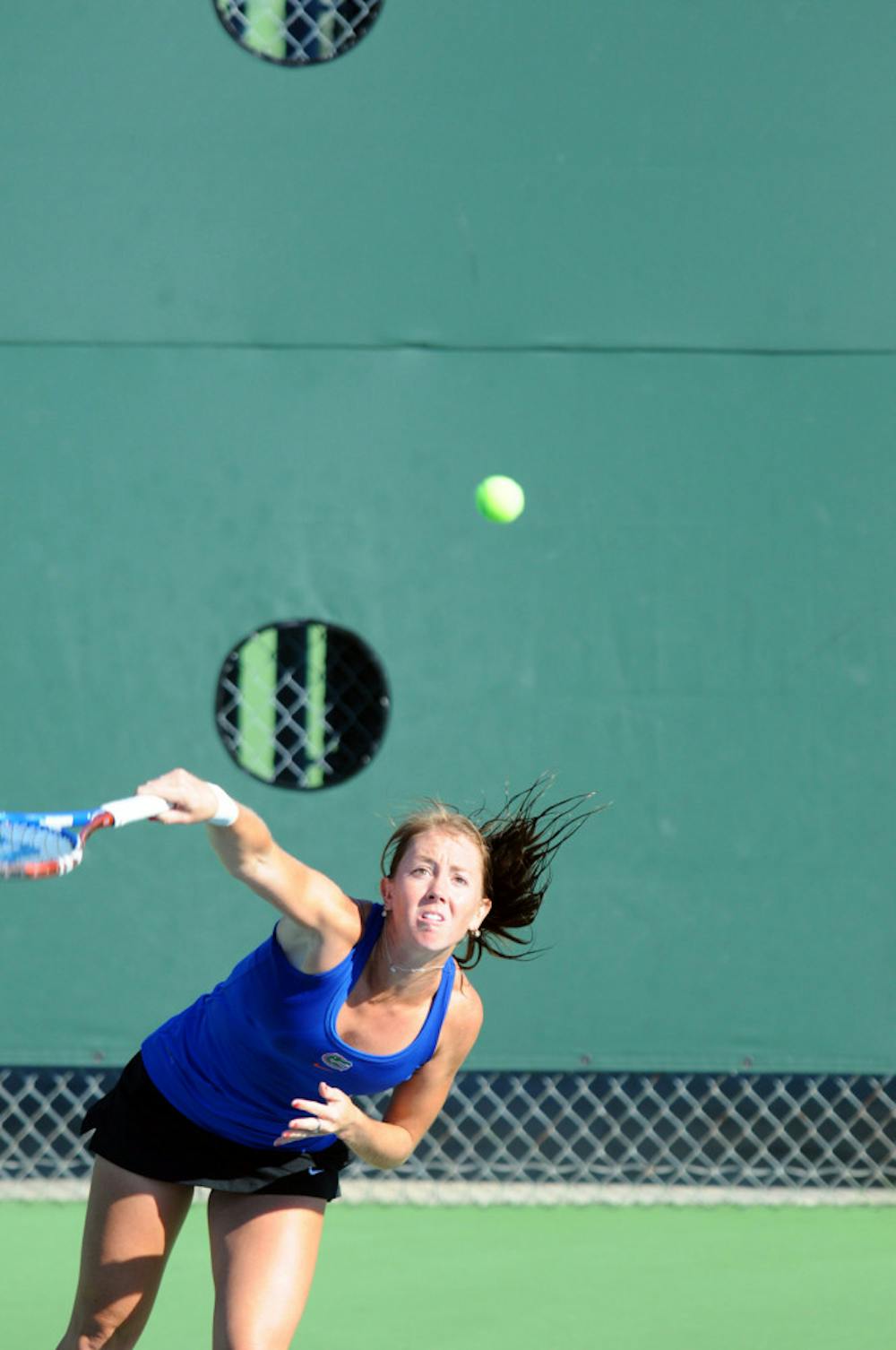 <p>Senior Lauren Embree serves during a match between Florida and Georgia on Oct. 24, 2011, at the Ring Tennis Complex.</p>