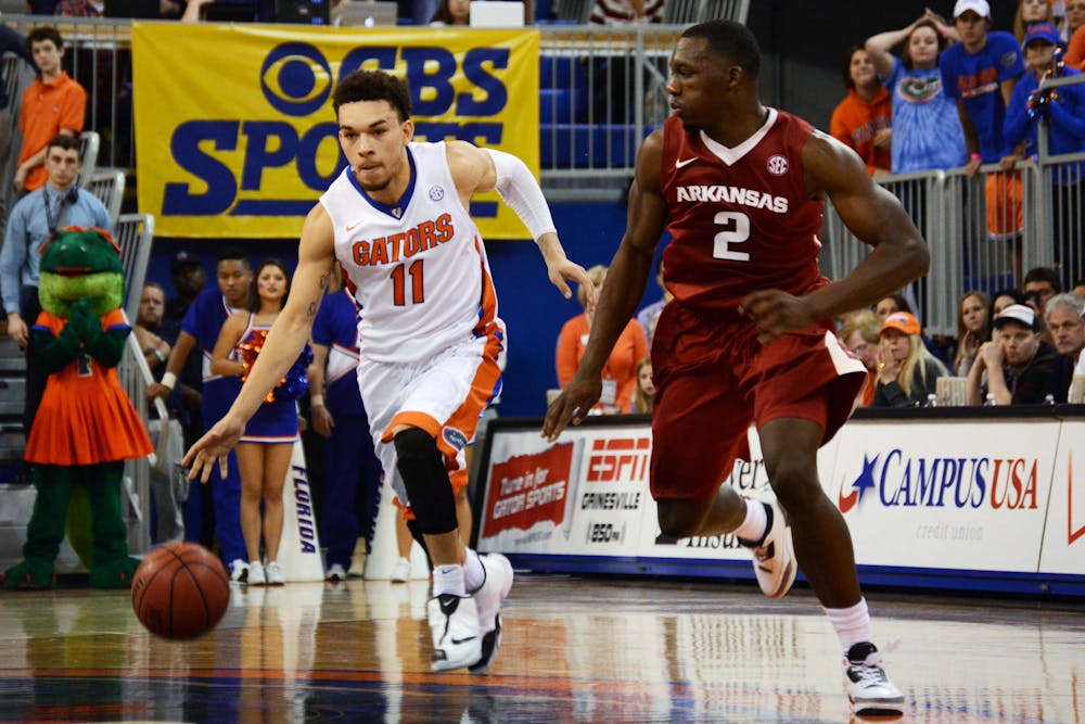 <p>Chris Chiozza drives the ball down the lane during Florida's 57-56 win against Arkansas on Saturday in the O'Connell Center.</p>